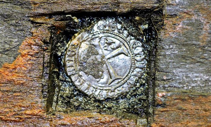 A silver French coin found hidden in the keel.